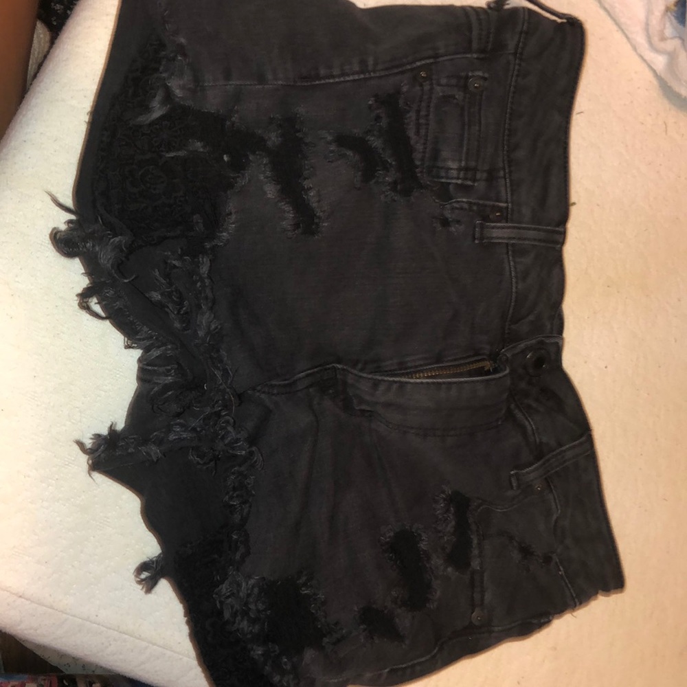 Black american eagle shorts with rips!